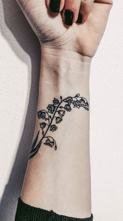 Watercolor calla lily tattoo on the wrist