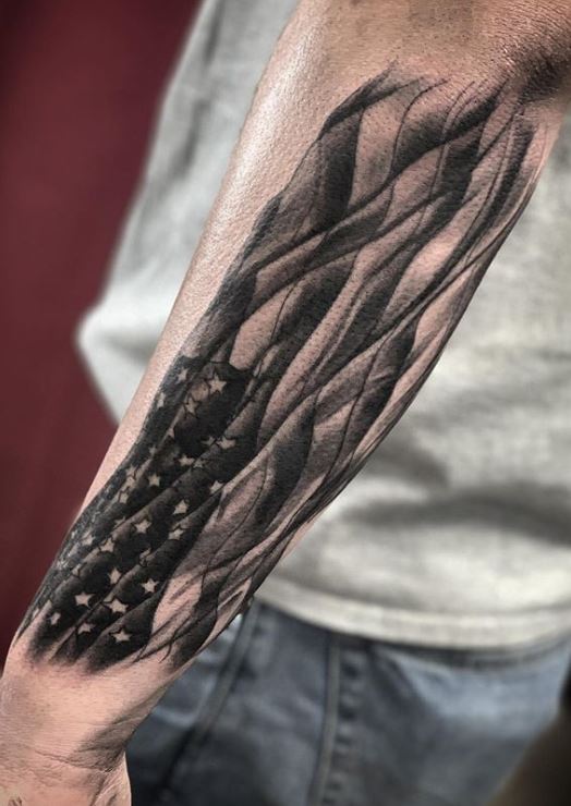 Art Junkies Tattoo Studio  Tattoos  Ethnic Flag  Realistic black and gray  flag added to previous tattoo Mike Riedl Art Junkies Tattoo