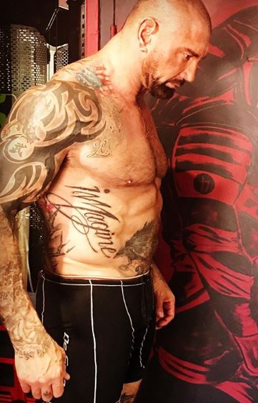 Untold Stories and Meanings Behind Dave Bautista's Tattoos - Tattoo Me Now