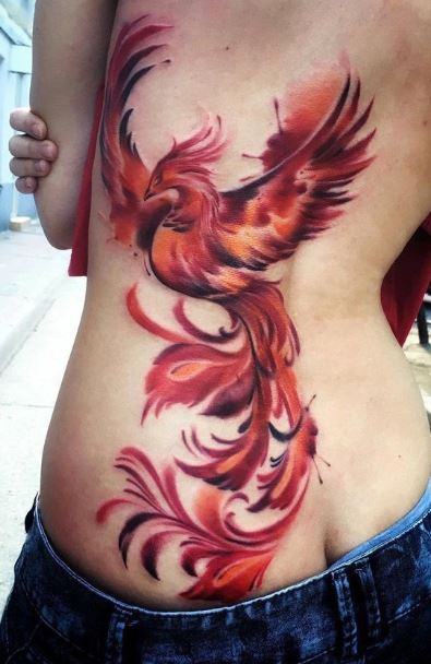 Girls cute phoenix tattoo on her foot