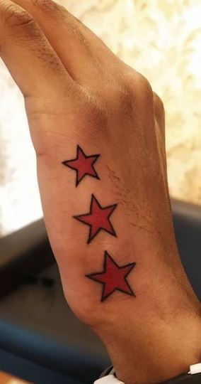 Fine line north star tattoo located on the hip