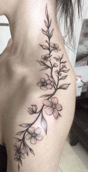 Tattoo uploaded by KTREW Tattoo  HandPoked Floral Spine Tattoo by  Pokeyhontas at KTREW Tattoo  Birmingham UK spinetattoo floraltattoo  daffodil holly backtattoo finelinetattoo  Tattoodo