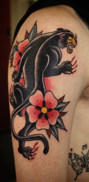 Traditional style black panther tattoo on the knee