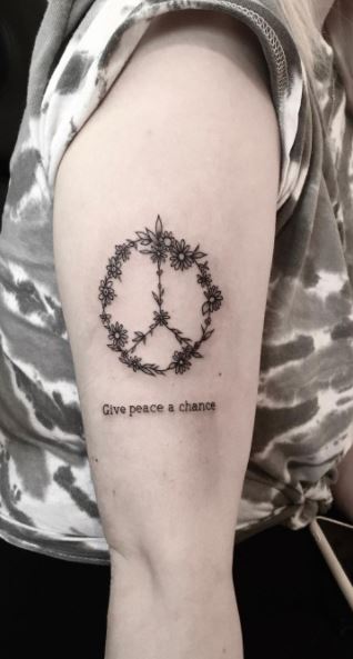 Inner peace tattoo on the left inner arm