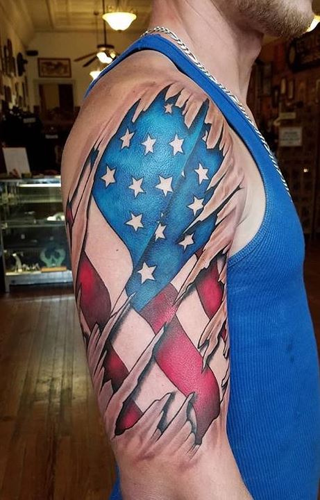 Skin tear American flag tattoo  Skin tear tattoo Flag tattoo Forearm  band tattoos