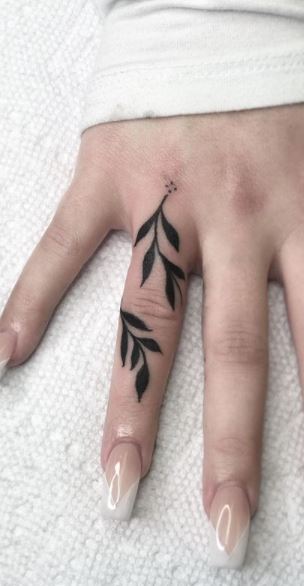 Ornamental finger tattoo