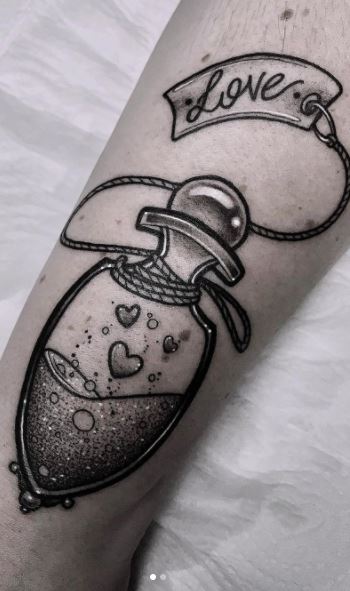 Love potion 9 tattoo done by Danica at Anchor Tattoo Parlor in  Hendersonville NC  rtattoo
