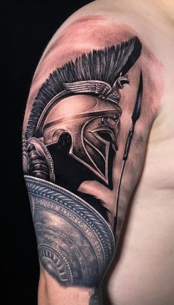Spartan tattoo on the left upper arm, inspired by 300.