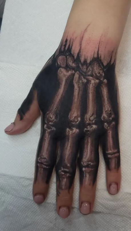 50 Incredible Skeleton Hand Tattoo Designs with Meaning 2022