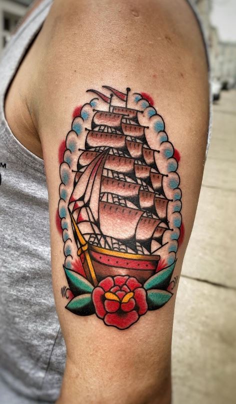 sailboat tattoo on shoulder