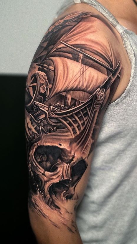 sailboat tattoo on shoulder