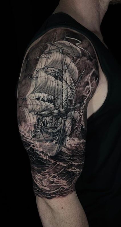 sailboat tattoo on shoulder