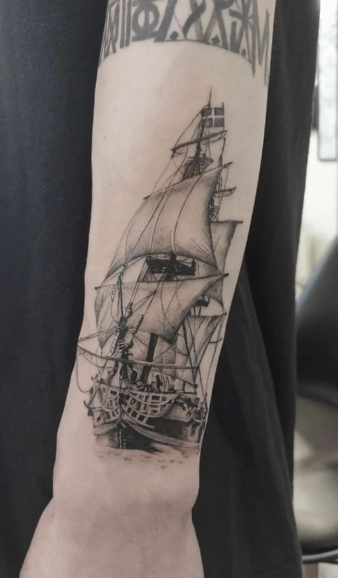 sailboat tattoo on shoulder