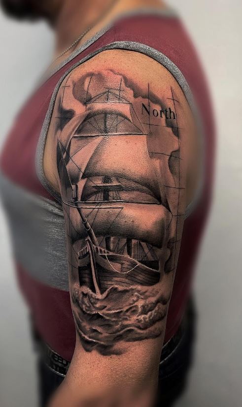 sailboat tattoo arm