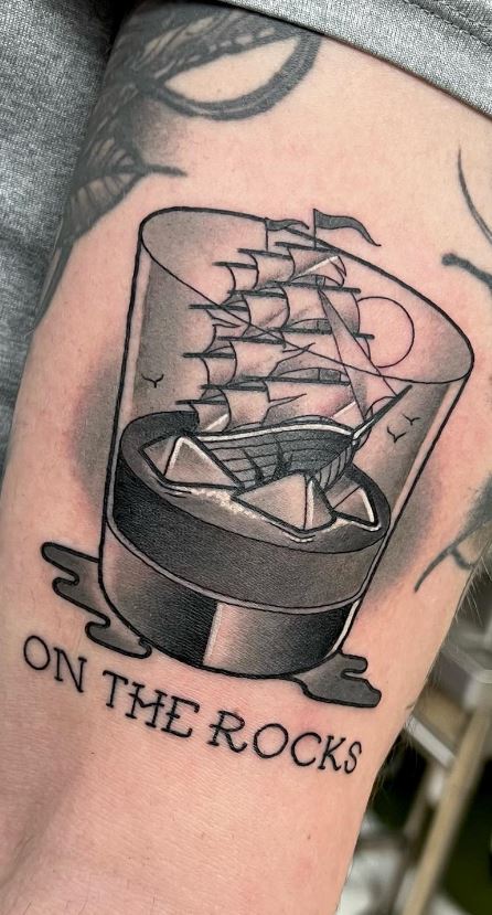 sailboat tattoo on shoulder